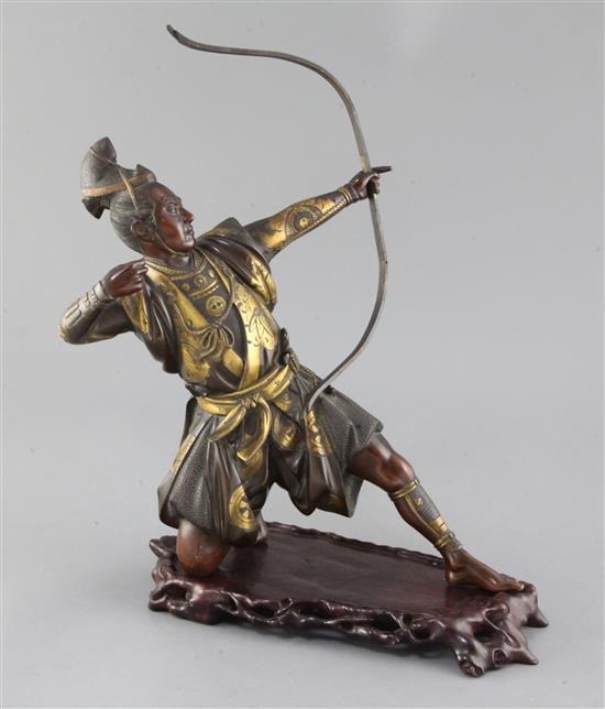 A Japanese bronze and parcel gilt figure of a kneeling archer, signed Yoshimitsu, Meiji period, height 37.5cm incl. carved wood stand